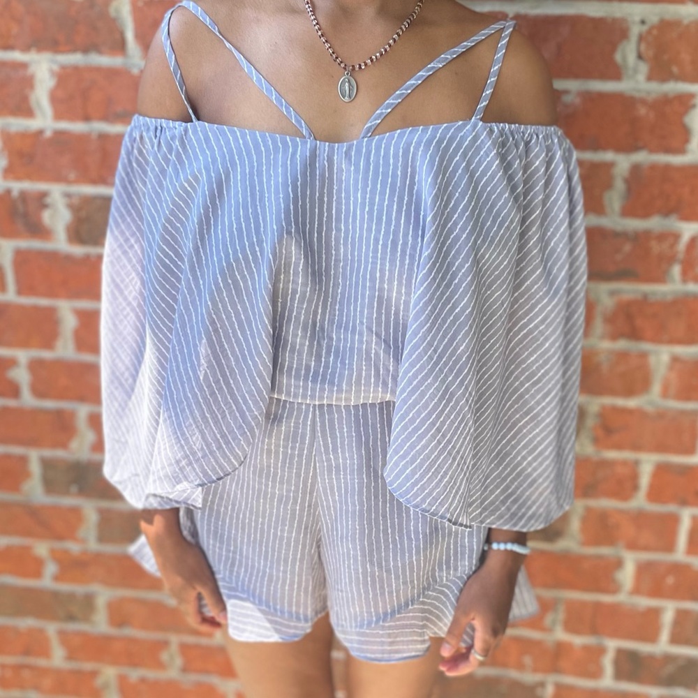 Gray and white romper. No tears or stains very cute to wear anywhere